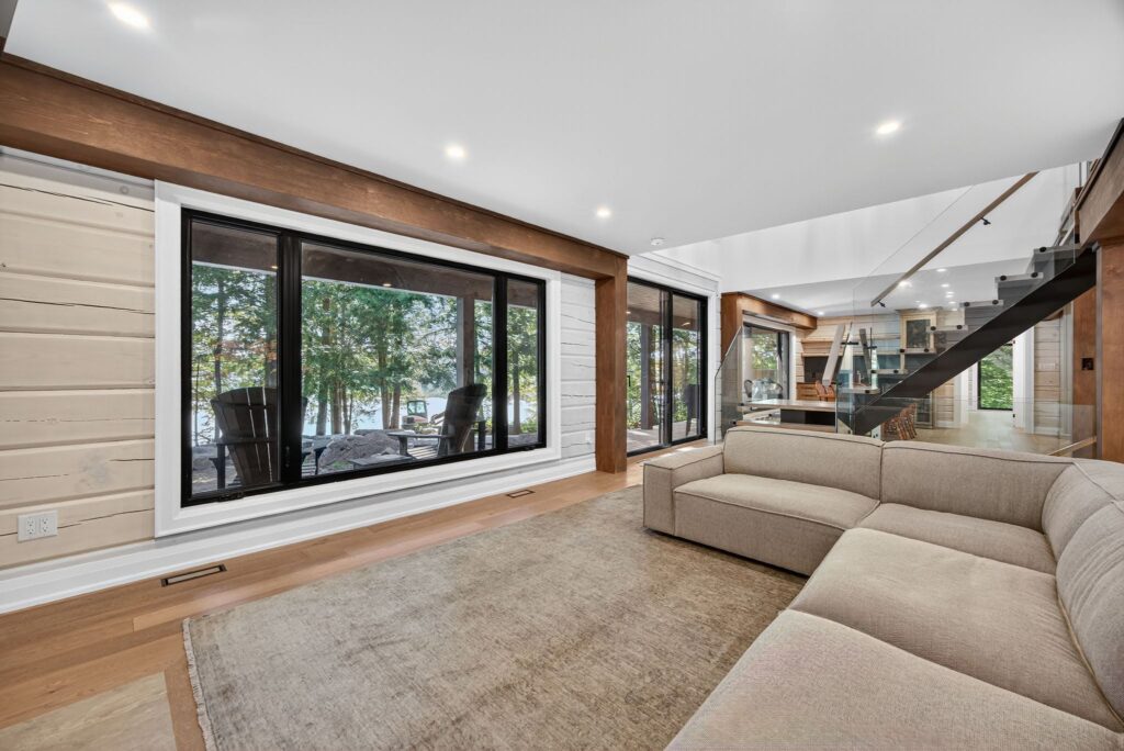 The living room of a log home renovated by Legacy North Construction Management. 