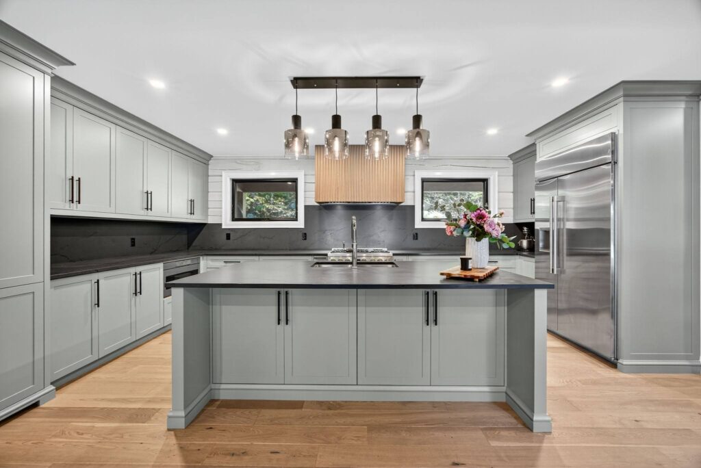 Quick Tip: Balance wood with other materials such as concrete, steel, stone, and glass. The contrasting textures of a polished stone countertops or black metals fixtures adds depth, sophistication, and balance to a wood-centric environment.