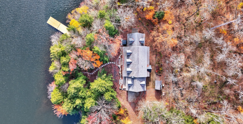 A log home based in Port Carling, Ontario is completely reimagined through this modern Renovation by Legacy North Construction Management.